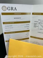 MaxSold Auction: Moissanite blue/green ring with report  - Brampton (Ontario, Canada) PARTNER MANAGED Commercial Liquidation Online Auction - Rosedale Avenue West