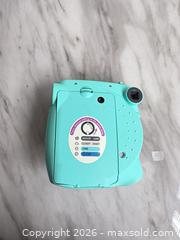 MaxSold Auction: Fujifilm Instax Mini 7S Instant Film Camera Mint/Turquoise - Decatur (Georgia, USA) SELLER MANAGED Reseller Online Auction - North Druid Hills Road (STORAGE)
