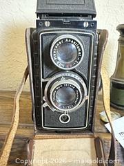 MaxSold Auction: Mantle Shelf Decor - Antique Bonculars & Camera  - Gilroy (California, USA) SELLER MANAGED Estate Sale Online Auction - Santa Paula Drive