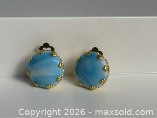 MaxSold Auction: Beautiful vintage clip-on earrings marked West Germany, featuring luminous blue art cabochons set in decorative gold-tone frames. - Campbell (California, USA) PARTNER MANAGED Estate Sale Online Auction -  Dell Avenue