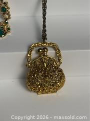MaxSold Auction: Vintage ART Signed Necklace/ Purse Pendant & Gold Tone Necklace with Green Accents - Campbell (California, USA) PARTNER MANAGED Estate Sale Online Auction -  Dell Avenue