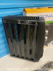 MaxSold Auction: Bionaire 1500W Oil Free Radiator Heater BOF1500-CN Portable w/ Box - Vancouver (British Columbia, Canada) SELLER MANAGED Reseller Online Auction - East 7th Avenue (STORAGE)