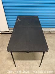 MaxSold Auction: Black Folding Table 24x48 Adjustable Height - Vancouver (British Columbia, Canada) SELLER MANAGED Reseller Online Auction - East 7th Avenue (STORAGE)