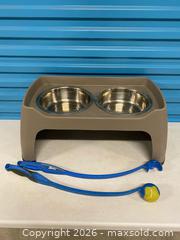 MaxSold Auction: Top Paw Raised Double Dog Bowl Stand w/ 2 Chuckit Ball Launchers & Tennis Ball - Vancouver (British Columbia, Canada) SELLER MANAGED Reseller Online Auction - East 7th Avenue (STORAGE)