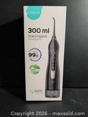 MaxSold Auction: Coslus Portable Black Oral Irrigator Water Flosser - Ottawa (Ontario, Canada) SELLER MANAGED Downsizing Online Auction - Regiment Avenue