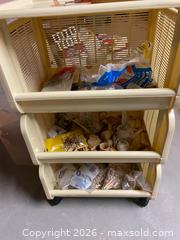 MaxSold Auction: Beige/Cream Plastic & Wood 3-Tier Rolling Cart Along with wooden crafting materials  - Longmont (Colorado, USA) PARTNER MANAGED Estate Sale Online Auction - Whitehall Drive