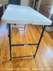 MaxSold Auction: Maxchief 4 ft Folding Table — White Plastic Top, Steel Legs - Longmont (Colorado, USA) PARTNER MANAGED Estate Sale Online Auction - Whitehall Drive
