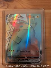 MaxSold Auction: Pokémon Pikachu VMAX Rainbow Holo Full Art Trading Card - Ottawa (Ontario, Canada) SELLER MANAGED Downsizing Online Auction - Regiment Avenue