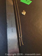 MaxSold Auction: 14k gold locket & 10k chain - Hamilton (Ontario, Canada) SELLER MANAGED Downsizing Online Auction - Cochrane Rd.