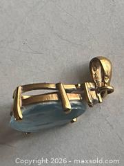 MaxSold Auction: Pear-Shaped Blue Faceted Stone Pendant in Yellow Metal Setting – Stamped Bail - Toronto (Ontario, Canada) SUPER SHORT NOTICE PARTNER MANAGED Estate Sale Online Auction -  Wellington Street East (CONDO)