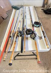 MaxSold Auction: Lot of 6 Fishing Rods & Reels, 6-7 ft, includes Net (Mixed Brands) - Acme (Alberta, Canada) SELLER MANAGED Moving Online Auction - Township Road 292