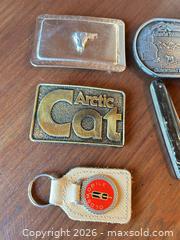 MaxSold Auction: Mixed Lot: Buckles, Cutting utensil, Lighter & Key Fob Collectibles - Acme (Alberta, Canada) SELLER MANAGED Moving Online Auction - Township Road 292