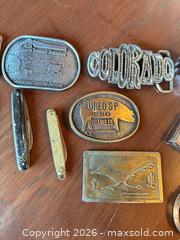 MaxSold Auction: Mixed Lot: Buckles, Cutting utensil, Lighter & Key Fob Collectibles - Acme (Alberta, Canada) SELLER MANAGED Moving Online Auction - Township Road 292