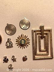 MaxSold Auction: Vintage Necklace and charm pendants and vintage hat pins - Tay Valley (Ontario, Canada) SELLER MANAGED Downsizing Online Auction - Clarchris Road