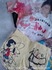 MaxSold Auction: 47-Piece Vintage & Modern Clothing Bundle – Peanuts, Toy Story, AOP Terry Fox, Nike & More!  - Toronto (Ontario, Canada) SELLER MANAGED Reseller Online Auction - Esandar Drive (STORAGE)