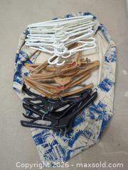 MaxSold Auction: Mixed Wood & Plastic Adult Coat Hangers (Approx. 20–35) - Saanich (British Columbia, Canada) PARTNER MANAGED Downsizing Online Auction - Gordon Point Drive