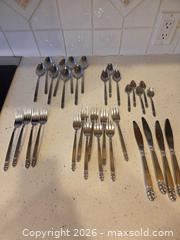 MaxSold Auction: Stainless Steel Flatware with Ornate Leaf/Scroll Handles - Saanich (British Columbia, Canada) PARTNER MANAGED Downsizing Online Auction - Gordon Point Drive