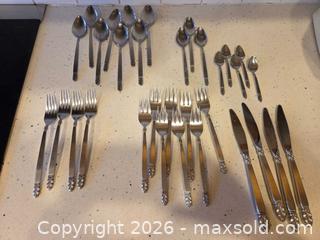 MaxSold Auction: Stainless Steel Flatware with Ornate Leaf/Scroll Handles - Saanich (British Columbia, Canada) PARTNER MANAGED Downsizing Online Auction - Gordon Point Drive