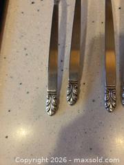 MaxSold Auction: Stainless Steel Flatware with Ornate Leaf/Scroll Handles - Saanich (British Columbia, Canada) PARTNER MANAGED Downsizing Online Auction - Gordon Point Drive
