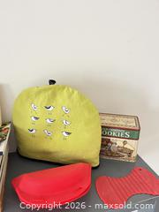 MaxSold Auction: Lot: Multiple Cookbooks with Tea Cozy, Red Silicone Bakeware & Cookie Tin - Greater Sudbury (Ontario, Canada) PARTNER MANAGED Moving Online Auction - Regent Street (CONDO)