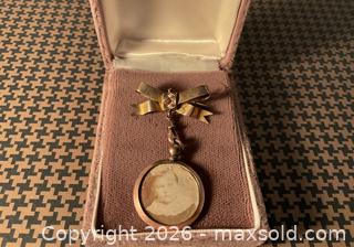 MaxSold Auction: Circa 1900 9K gold memorial bow brooch with hanging picture fob, England - Ottawa (Ontario, Canada) SELLER MANAGED Downsizing Online Auction - Tall Forest Drive