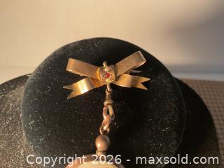 MaxSold Auction: Circa 1900 9K gold memorial bow brooch with hanging picture fob, England - Ottawa (Ontario, Canada) SELLER MANAGED Downsizing Online Auction - Tall Forest Drive