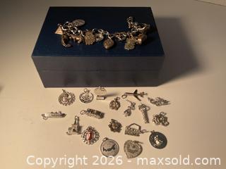 MaxSold Auction: Sterling silver charm bracelet and lots of additional charms (82.48 grams) - Ottawa (Ontario, Canada) SELLER MANAGED Downsizing Online Auction - Tall Forest Drive