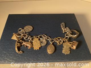 MaxSold Auction: Sterling silver charm bracelet and lots of additional charms (82.48 grams) - Ottawa (Ontario, Canada) SELLER MANAGED Downsizing Online Auction - Tall Forest Drive