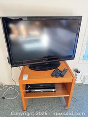 MaxSold Auction: 40" Television with Stand, DVD Player and Multiple Remotes - Saanich (British Columbia, Canada) PARTNER MANAGED Moving Online Auction - Arbutus Road