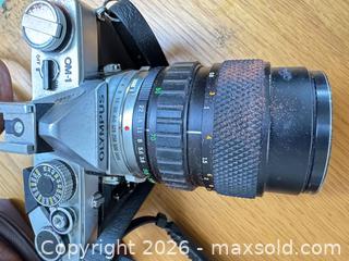 MaxSold Auction: Olympus OM-1 Film SLR Body with Mounted Zoom Lens and Accessories - Saanich (British Columbia, Canada) PARTNER MANAGED Moving Online Auction - Arbutus Road