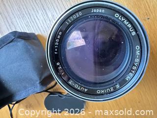 MaxSold Auction: Olympus OM-1 Film SLR Body with Mounted Zoom Lens and Accessories - Saanich (British Columbia, Canada) PARTNER MANAGED Moving Online Auction - Arbutus Road