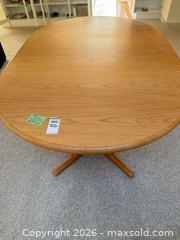 MaxSold Auction: Oval Solid Wood Extendable Dining Table with Leaf, Light/Medium Brown - Saanich (British Columbia, Canada) PARTNER MANAGED Moving Online Auction - Arbutus Road