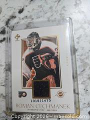 MaxSold Auction: NHL- ROMAN CHECHMANEK #'d Jersey Card - Kingston (Ontario, Canada) SELLER MANAGED Downsizing Online Auction - Morenz Cresecent