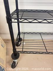 MaxSold Auction: Black metal rolling storage rack lot 317 - Ottawa (Ontario, Canada) SELLER MANAGED Downsizing Online Auction -  Cinnabar