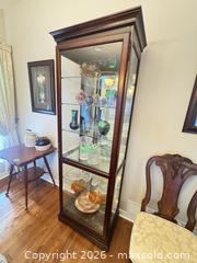 MaxSold Auction: Howard miller Light up glass display case  - Ottawa (Ontario, Canada) SELLER MANAGED Downsizing Online Auction -  Cinnabar