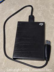 MaxSold Auction:  Seagate One Touch 1TB External Hard Drive - Toronto (Ontario, Canada) SELLER MANAGED Downsizing Online Auction - McAdam Avenue
