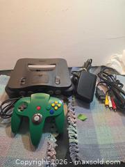 MaxSold Auction: Nintendo 64 game console with special green controller - Toronto (Ontario, Canada) SELLER MANAGED Estate Sale Online Auction - Saunders Road