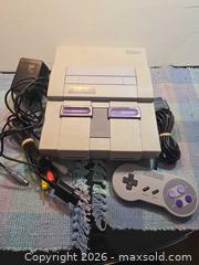 MaxSold Auction: Super Nintendo game console With controller And adapters - Toronto (Ontario, Canada) SELLER MANAGED Estate Sale Online Auction - Saunders Road