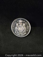 MaxSold Auction: 1963 Silver 50 Cent Coin  - Loyalist (Ontario, Canada) SELLER MANAGED Downsizing Online Auction - Somerset Drive