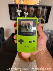 MaxSold Auction: Vintage Gameboy Colour Lime Green Game Console Tested Working - Toronto (Ontario, Canada) SELLER MANAGED Downsizing Online Auction -  Palamar Road