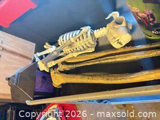 MaxSold Auction: Halloween Plastic Decoration Lot — Tombstones, Skeleton Parts, Props - Toronto (Ontario, Canada) SELLER MANAGED Moving Online Auction - Enfield Avenue