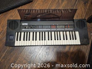 MaxSold Auction: Lowrey Micro Genie Electronic Keyboard, Black - Toronto (Ontario, Canada) SELLER MANAGED Moving Online Auction - Enfield Avenue