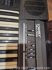 MaxSold Auction: Lowrey Micro Genie Electronic Keyboard, Black - Toronto (Ontario, Canada) SELLER MANAGED Moving Online Auction - Enfield Avenue