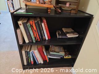 MaxSold Auction: 3-Tier Particleboard Bookshelf with Mixed Books B - Ottawa (Ontario, Canada) PARTNER MANAGED Downsizing Online Auction - Topley Crescent