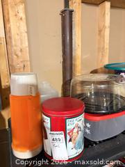 MaxSold Auction: Assorted Decorative & Cookie Tins with Glass and Plastic Storage Jars B - Ottawa (Ontario, Canada) PARTNER MANAGED Downsizing Online Auction - Topley Crescent