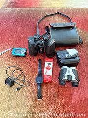 MaxSold Auction: Mixed Optics & Electronics: Bushnell Binoculars, Polaroid Camera, Fitbit A - Ottawa (Ontario, Canada) PARTNER MANAGED Downsizing Online Auction - Topley Crescent