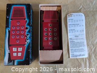 MaxSold Auction: Merlin Red Handheld Electronic Game (1970s Vintage) - Welland (Ontario, Canada) SELLER MANAGED Reseller Online Auction - Young Road