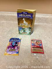 MaxSold Auction: New! Disney Lorcana Into the Inklands Starter Deck, Booster & Mickey Card - Welland (Ontario, Canada) SELLER MANAGED Reseller Online Auction - Young Road