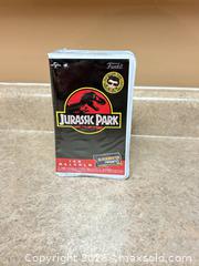 MaxSold Auction: New Funko Jurassic Park Ian Malcolm Vinyl Figure (Blockbuster Rewind) - Welland (Ontario, Canada) SELLER MANAGED Reseller Online Auction - Young Road