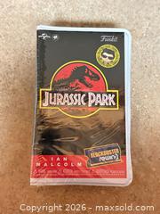 MaxSold Auction: New Funko Jurassic Park Ian Malcolm Vinyl Figure (Blockbuster Rewind) - Welland (Ontario, Canada) SELLER MANAGED Reseller Online Auction - Young Road